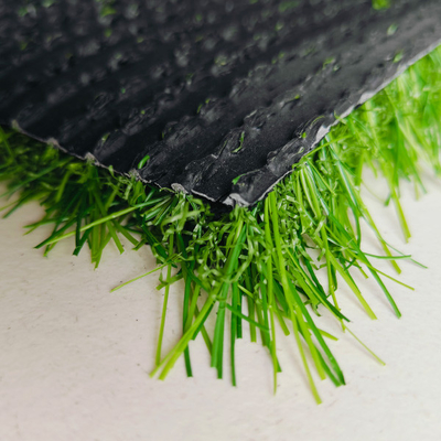 ถาดหญ้าสังเคราะห์ที่ไม่เต็ม 25 มม หญ้าประดิษฐ์สูง Dtex สําหรับสนามกีฬาและตกแต่งผืนดิน